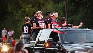 The crowd cheers on the Thompson High School football players during the Alabaster homecoming parade on Sept. 30. (Reporter Photo/Neal Wagner)