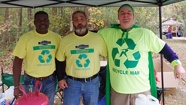 Alabaster Environmental Services employees, from left, Casey Oliver, Brian Lorino and Bill Atkinson greet visitors at the city’s Fall Fest on Oct. 31. (Reporter Photo/Neal Wagner)