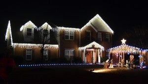 The Palacios family, of Heather Lane, won Pelham’s residential award for their classic Christmas decorations. (Reporter photo / Jessa Pease)  