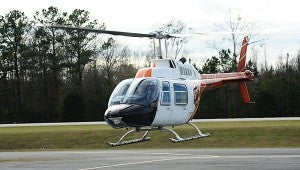 Shelby County Sheriff’s Office Lt. Dennis Blackerby and Capt. Jeff Hartley lift off the ground in the office’s newly acquired helicopter on Dec. 16. (Reporter Photo/Neal Wagner)