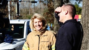 Alabaster Mayor Marty Handlon, left, laughs with Alabaster Fire Chief Jim Golden, right, before entering a smoke-filled house during a Dec. 4 training exercise. (Reporter Photo/Neal Wagner)