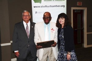 Eddie Huggins, center, receives the Citizens Observer Patrol of the Year award for the city of Chelsea at this year's Safety Awards Luncheon hosted by the Greater Shelby County Chamber of Commerce on Sept. 30. Huggins is pictured with Chelsea Mayor Earl Niven and Chamber Chair Lisa McMahon. (File)