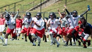 The Thompson 7-on-7 team celebrates a victory during the National 7-on-7 Tournament in Hoover, which took place from July 14-16. (Reporter Photo / Keith McCoy)