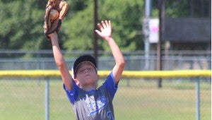 Camden Harper snags a pop up in centerfield for the Steal Dawgz during the 9U Dizzy Dean state tournament. (Contributed)